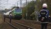 French police stand guard as the halted train carrying nuclear waste is blocked in Caen